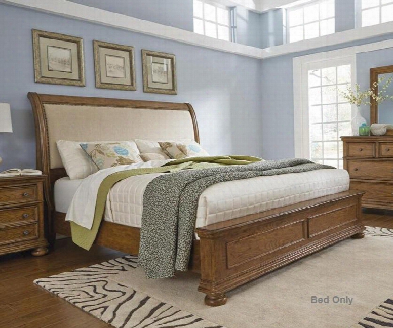 8674q Queen Size Bed With Sleigh Style Headboard Curved Upholstered Panel Nail Head Trim Molding Detailing And Bun Feet In Medium Wood