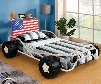 Freedom Racer Collection CM7765-BED Twin Size Bed with Race Car Design Headboard Shelf USA Flag Leatherette Headboard and Metal Construction in White