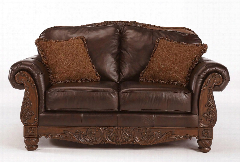 North Shore 2260335 69" Stationary Leather Wood Frame Loveseat With Fringed Pillows Otnate Carvings On The Frame Arched Back And Rolled Arms In Dark Brown