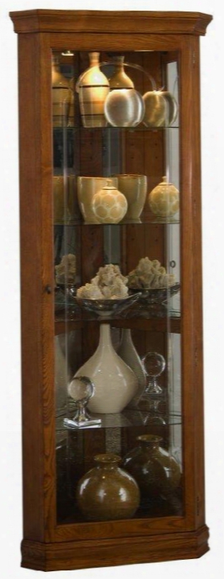 D022005 28" Corner Curio Cabinet With 4 Glass Shelves Glass Door Mirrored Back Interior Lighting And Antique Brass Hardware In Golden Oak